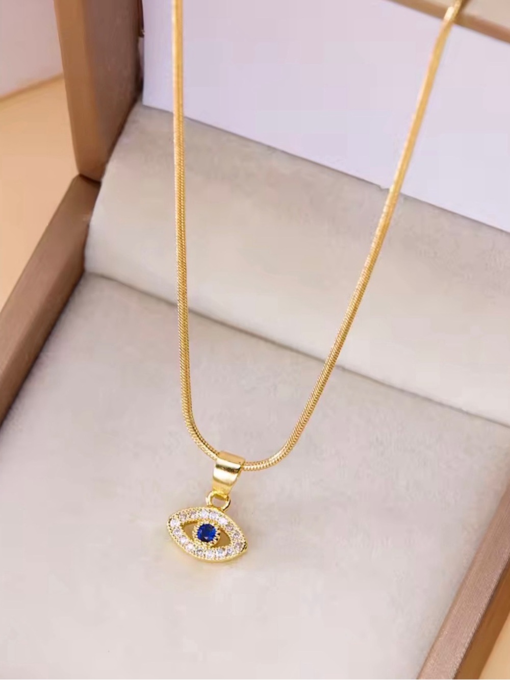 Anthropologie Gold Eye Pendant Necklace with Blue Center Gem NWOT